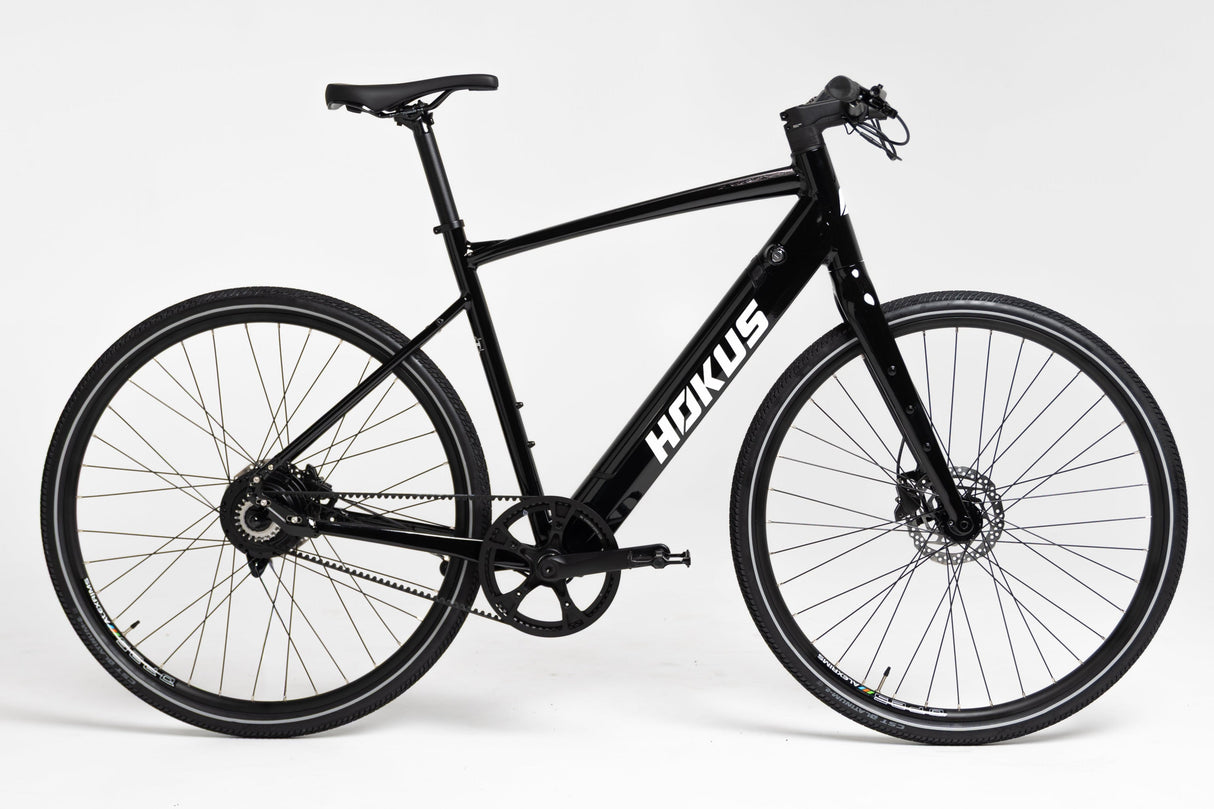Sleek Black Surge Electric Commuter Bike: 90km Range, Carbon Drive, Lightweight Urban Ride