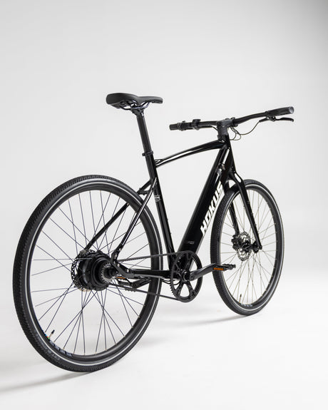 Sleek Black Surge Electric Commuter Bike: 90km Range, Carbon Drive, Lightweight Urban Ride