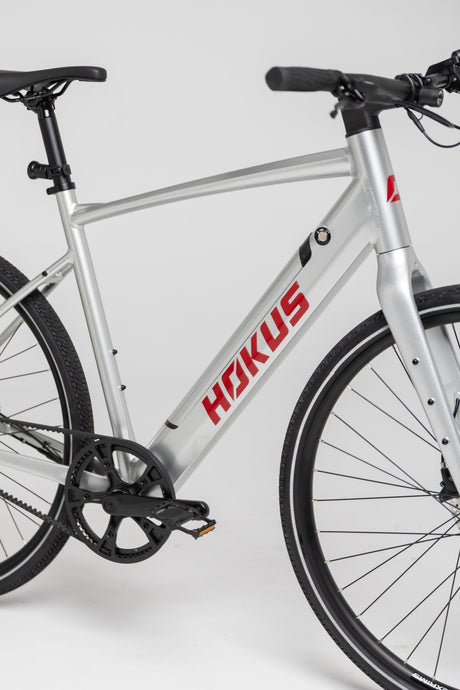 Hokus Surge Silver Electric Commuter Bike: Lightweight, Long Range, Carbon Drive, Hydraulic Brakes